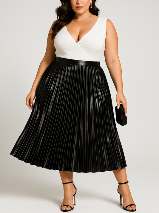Woman wearing a white top and black pleated skirt on a plain background