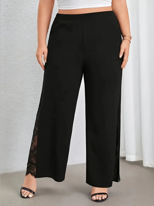 Black wide-leg pants with lace detailing worn by a person against a neutral background