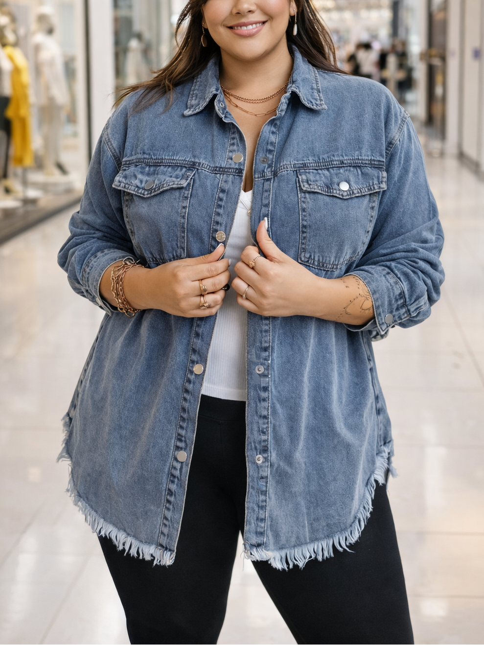 Woman wearing a denim jacket in a shopping mall