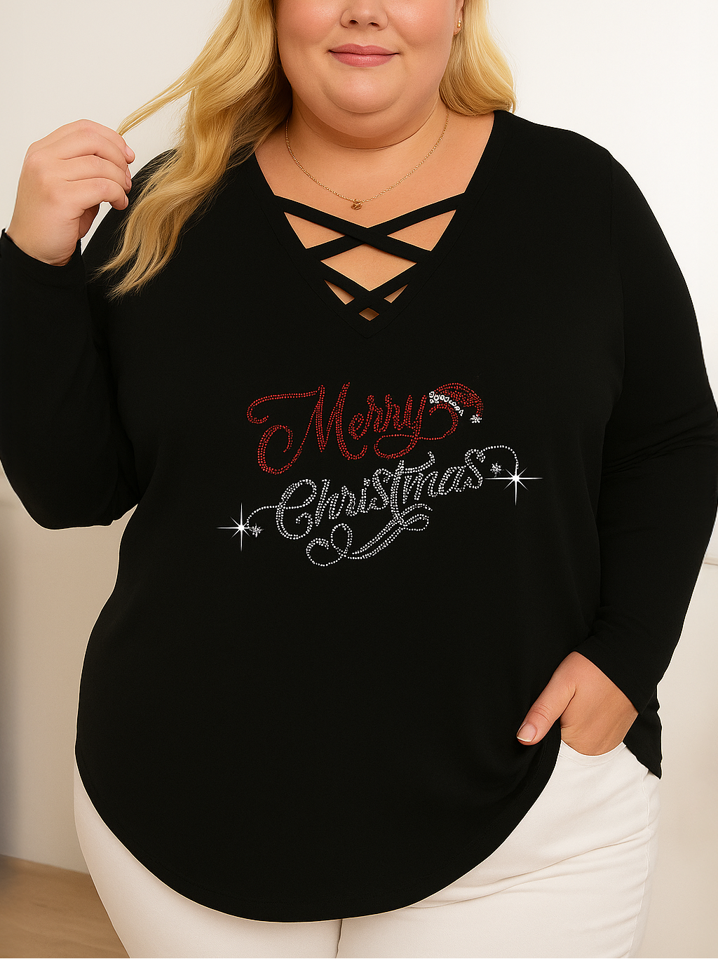 Person wearing a black sweater with 'Merry Christmas' text