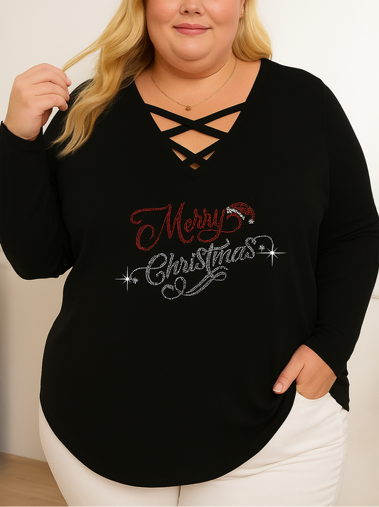 Person wearing a black sweater with 'Merry Christmas' text