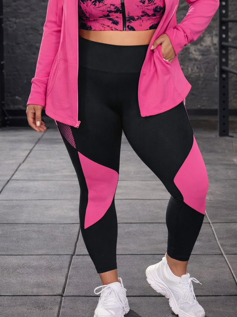 Person wearing a pink and black athletic outfit on a gray pavement background