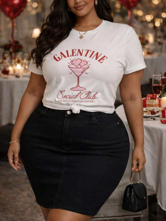 Woman wearing a 'Valentine Social Club' t-shirt at a festive indoor event.