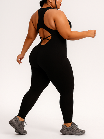 Person wearing a black jumpsuit with cut-out design on a white background