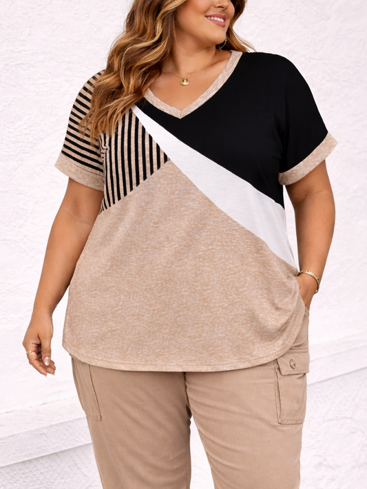Woman wearing a color-blocked top and beige pants on a white background