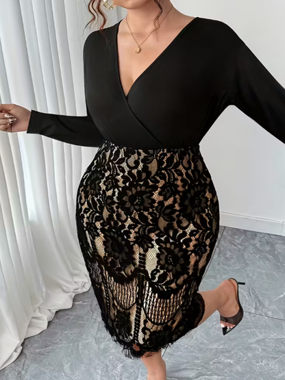 Person wearing a black long-sleeve top and leopard print skirt in a room with white curtains.