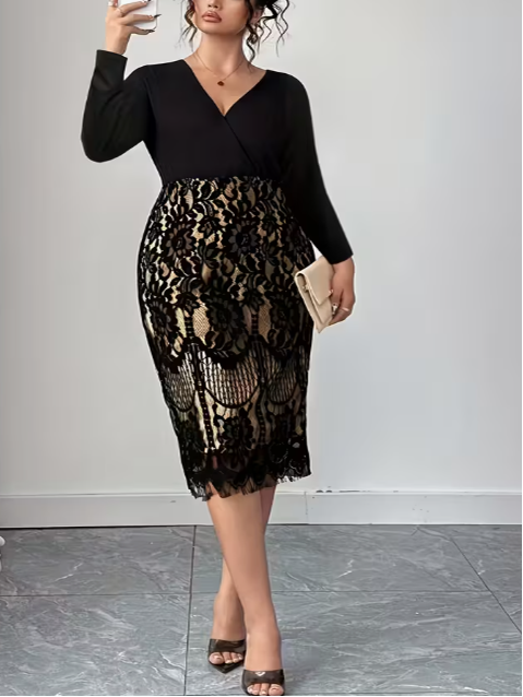 Woman taking a selfie wearing a black top and black lace skirt against a white wall.