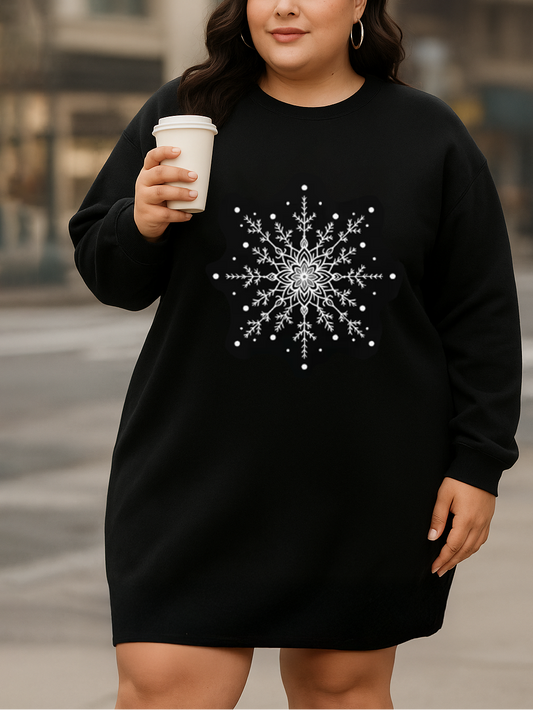 Woman wearing a black sweatshirt with a snowflake design, holding a coffee cup in an urban setting.